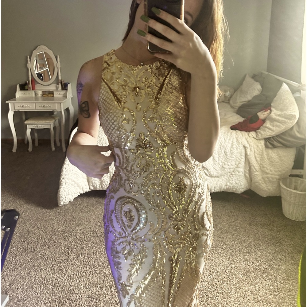 Gold prom/formal dress. Size 3. No damage only worn for a few hours.
